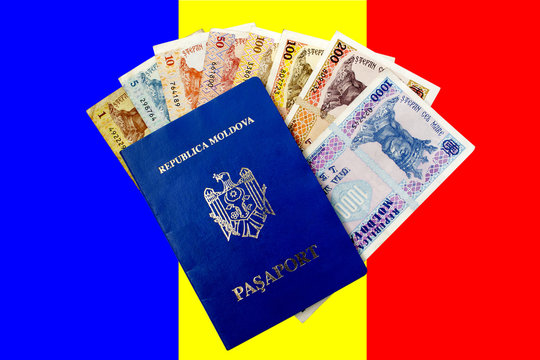 Moldovan money and passport against the background of tricolor