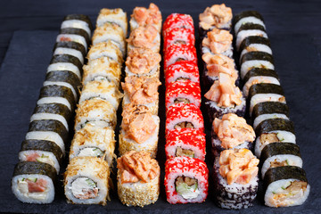 Tasty multicolored maki sushi rolls set. Japanese food, sushi restaurant serving