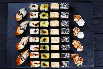 Delicious nigiri and maki sushi set, flat lay. Luxury restaurant menu
