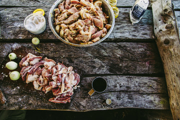 Raw meat on old wooden table, gray vintage decks background