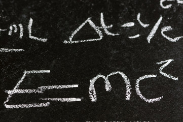 Mathematical derivation of E=mc^2 on a blackboard