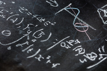 Mathematical equations on a blackboard