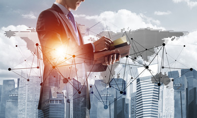 Concept of business success and control with confident boss against cityscape background