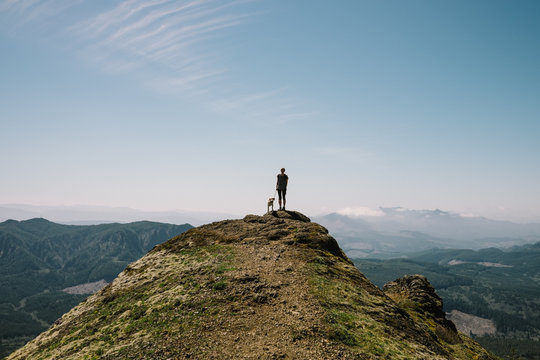 Woman and dog at a lookout point
