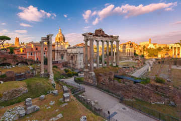 Fototapeta na wymiar Ancient ruins of a Roman Forum or Foro Romano at sunset in Rome, Italy. View from Capitoline Hill