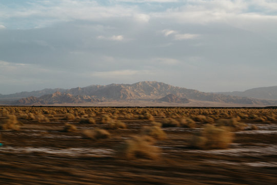 southwest landscape blurring by in car during road trip