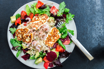 Warm Salad from Brown Rice, Quinoa, Prawns, Halloumi and Veg
