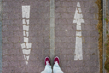 Arrows going up and down, red sneakers, footsie, personal perspective