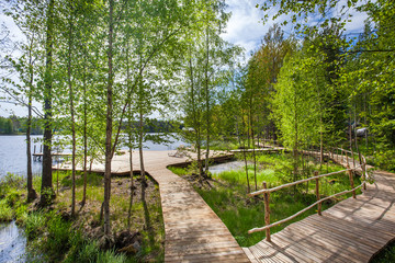 Fototapeta na wymiar Wooden bathing bridges in the lake