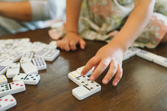 Child Working With Domino's For Homeschool Math Lesson