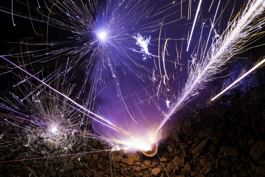 Aerial View of Exploding Fireworks on Rocky Beach