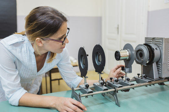 Female Physicist Doing Experiment in a Lab