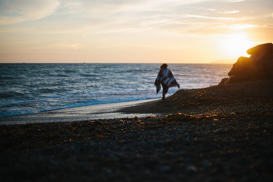 Beach Walk At Sunset