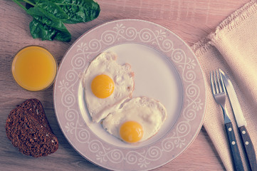 scrambled eggs with spinach on the plate - a healthy Breakfast with orange juice