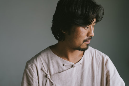 Portrait of a Chinese man wearing traditional cloth