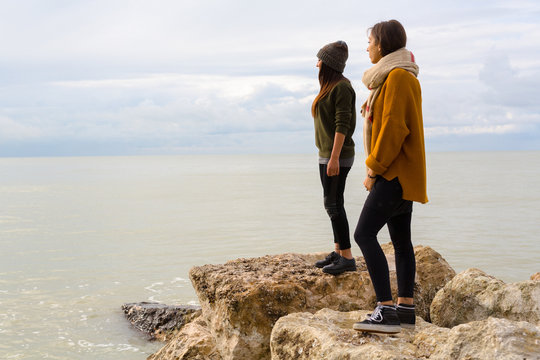 Two Female Friends looking the ocean