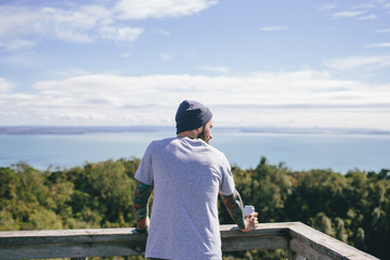 Hipster man on a view point from behind