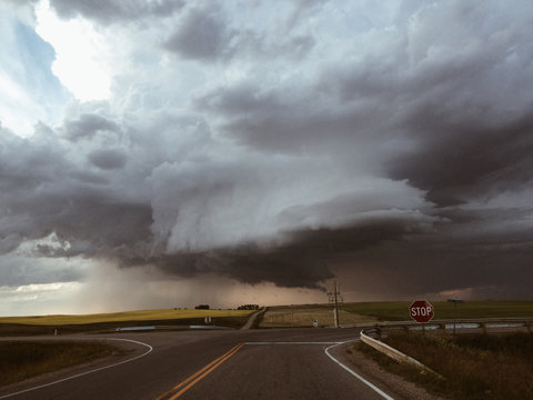 Moody storm cloud over a rural highway