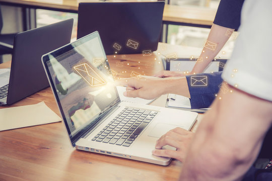 Sending Email, Gesture Of Finger Pressing Send Button On A Computer Keyboard With People In Office, Communication Concept.