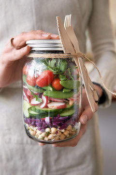 fresh colorful salad sealed in a mason jar