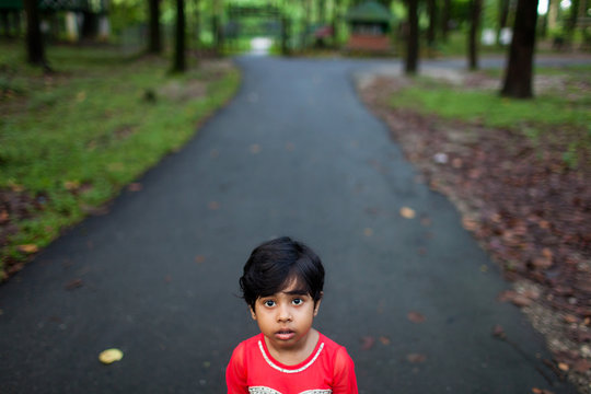 Cute little girl looking at camera with a blank expression