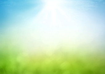 World environment day concept: Abstract blurred beautiful green bokeh light meadow and blue sky on...