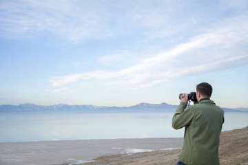male takes photos over the great salt lake