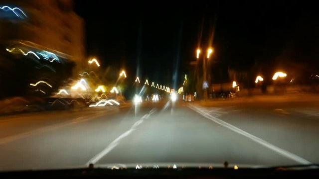 Trip by car, moving on the night street city road, Traffic along the highway. Night timelapse. High speed, road and roadside, oncoming cars. Motor transport, Vehicle hyperlapse 