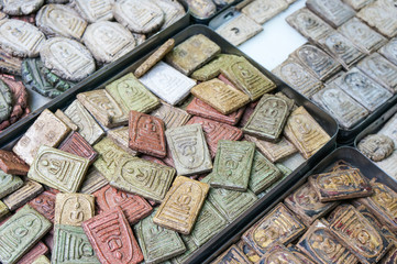 Famous amulet market with stone Buddhist talismans bringing luck and good fortune in Bangkok...