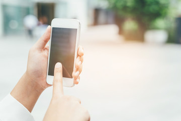 Closeup of woman hands using smartphone