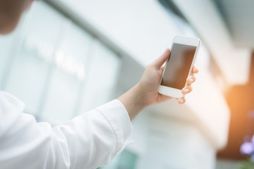 Closeup of woman hands using smartphone