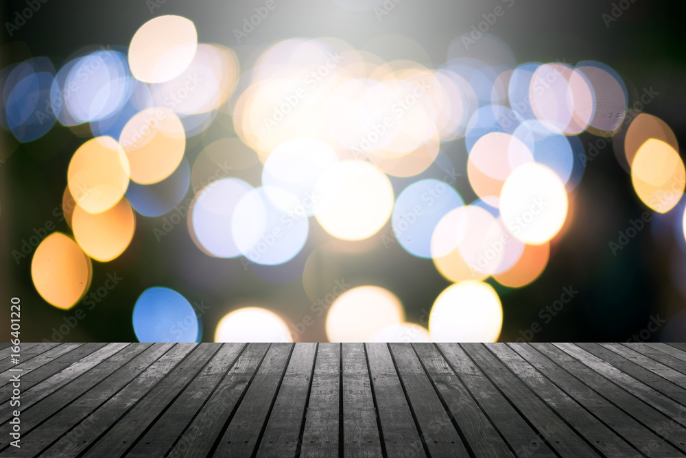 Poster image of wood table and blurred bokeh background with colorful lights .