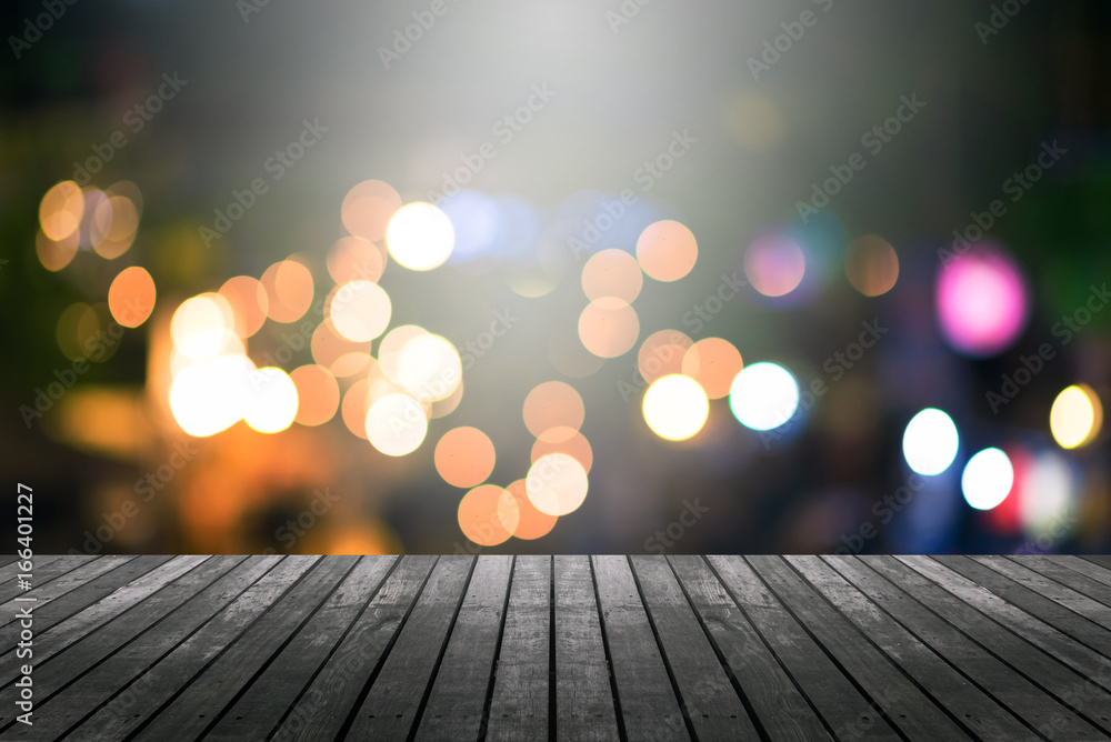 Poster image of wood table and blurred bokeh background with colorful lights .