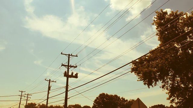 Indie Hipster Timelapse against telephone lines