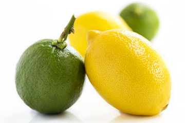 Lemons and limes isolated on white background.