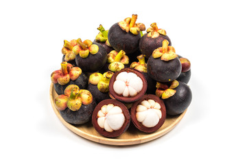 Fresh Mangosteen from Rayong Thailand on wooden plate isolated on white background