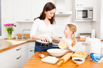 Mother And Daughter Baking Cookies