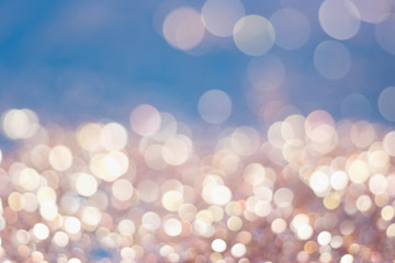 Abstract golden glitter vintage lights background. Defocused gold bokeh abstract background light.