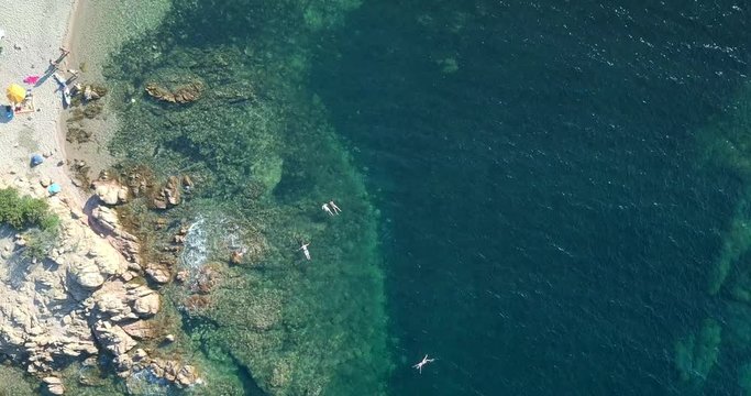 Video from above, aerial view of an amazing beach and turquoise sea in Sardinia, Italy