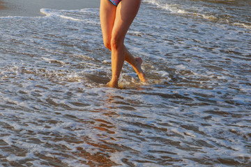 Beach travel - Woman walking on sand beach