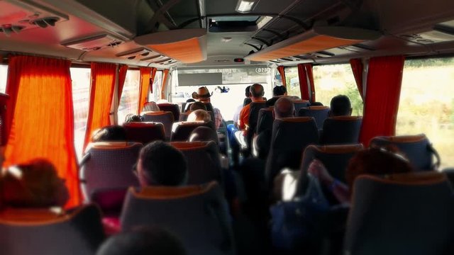 Transport, transfer and tourism. Tourists passengers people are traveling by bus on the road