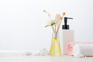 SPA Decoration. Spa composition with cosmetic bottle and aromatherapy over white.