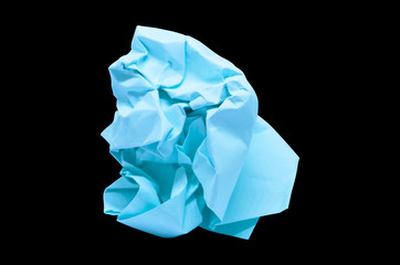 Obraz premium blue wrinkled paper ball on black background, symbol of recycling and wasting our resources,clipping path