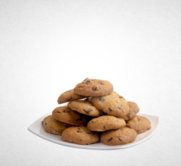 Cookies or Chocolate chips cookies on background.