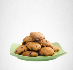 Cookies or Chocolate chips cookies on background.