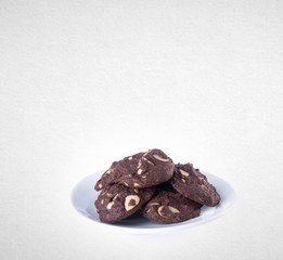 Cookies or Almonds chocolate cookies on background.