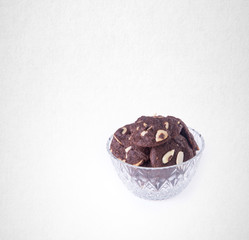 Cookies or Almonds chocolate cookies on background.