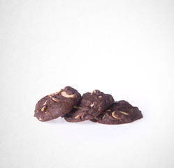 Cookies or Almonds chocolate cookies on background.