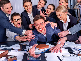 Business people office. Team people are unhappy with their leader. Intern man manager does not cope with his duties. Crowd in stress throw up their chief's papers. New employee is recruited.