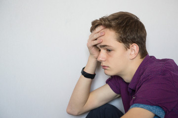 Portrait of a sad tired teenager